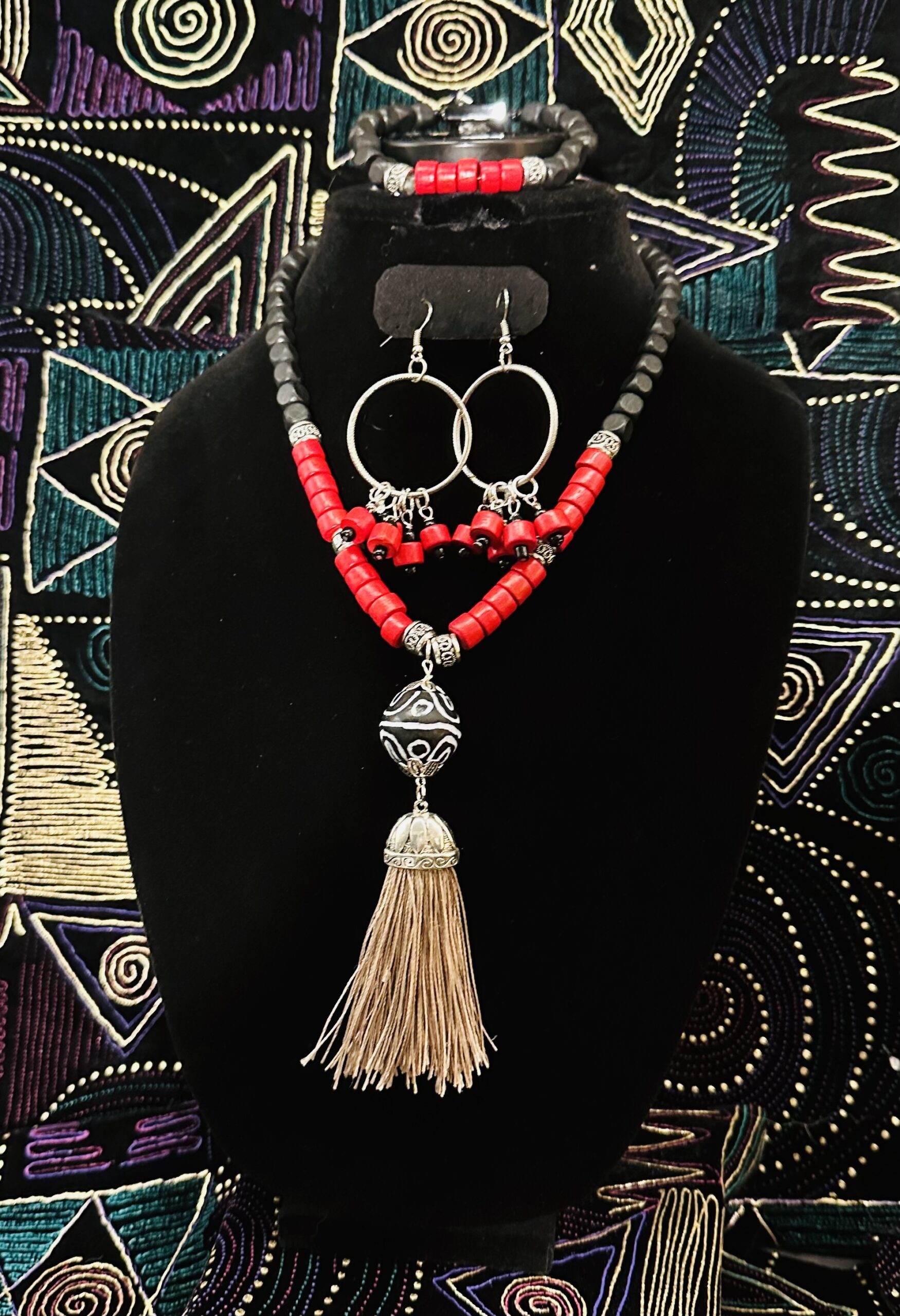 Three-piece necklace set with red and black wood beads in a Ghana bead accent